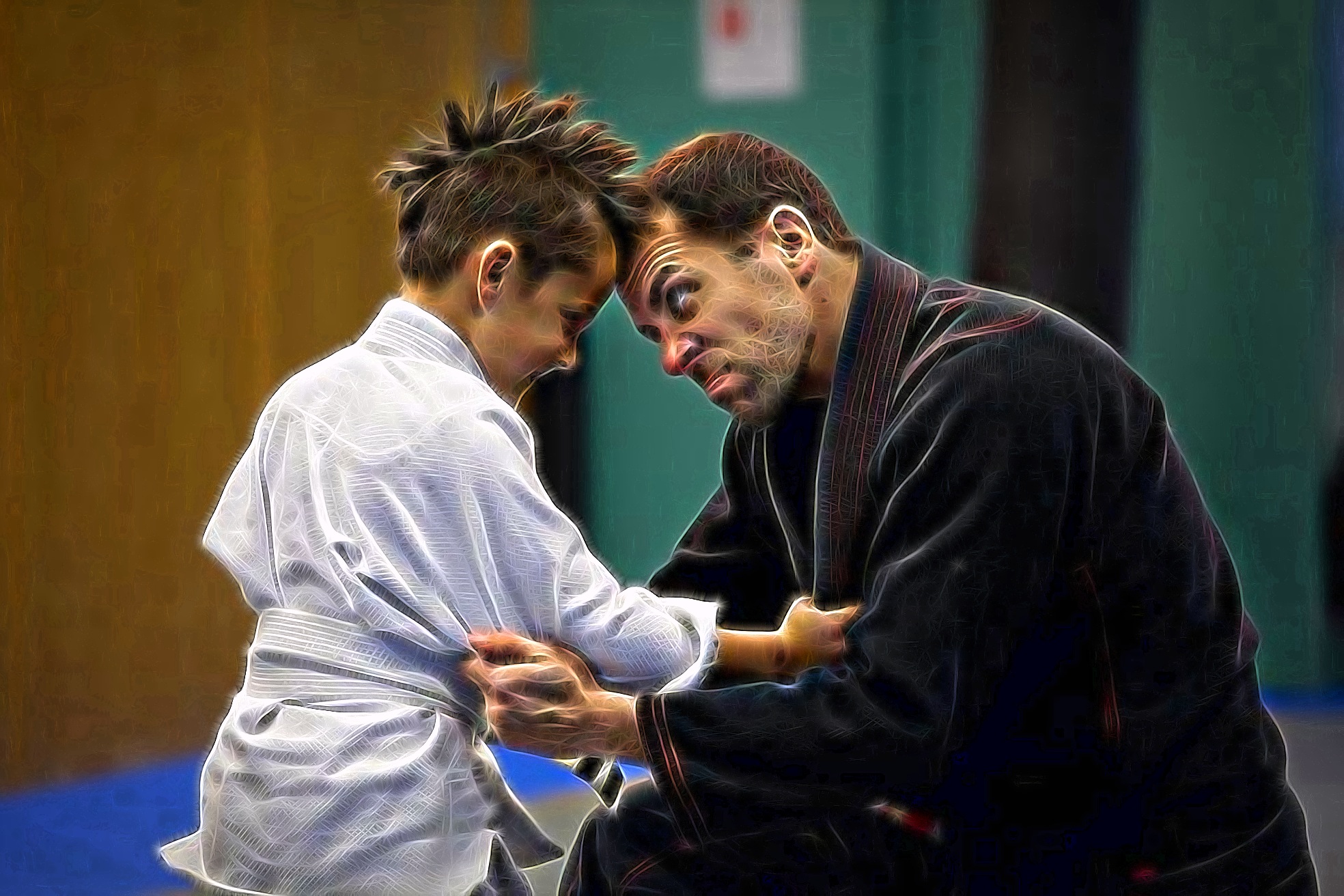 BJJ instructor playfully training with a young student, capturing the family spirit of Busy BJJ